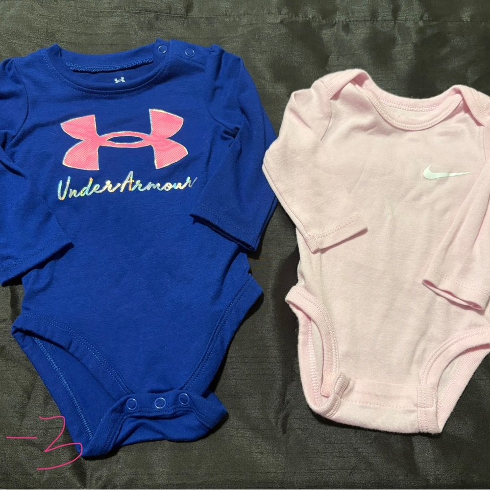 Under Armour and Nike Blue and Pink Baby Bodysuits